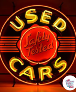 Neon Used Cars sign lit