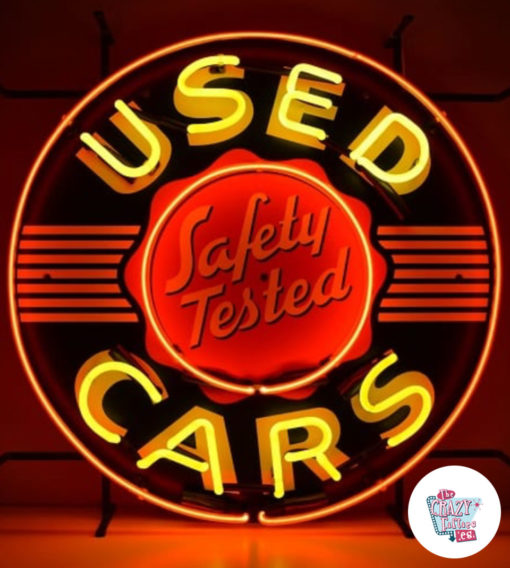 Neon Used Cars sign lit