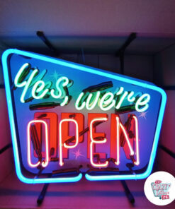Neon Yes we're open sign in front
